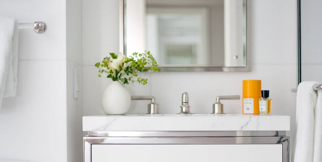 Philip House Secondary bathrooms feature Misty Blue honed limestone floors.
