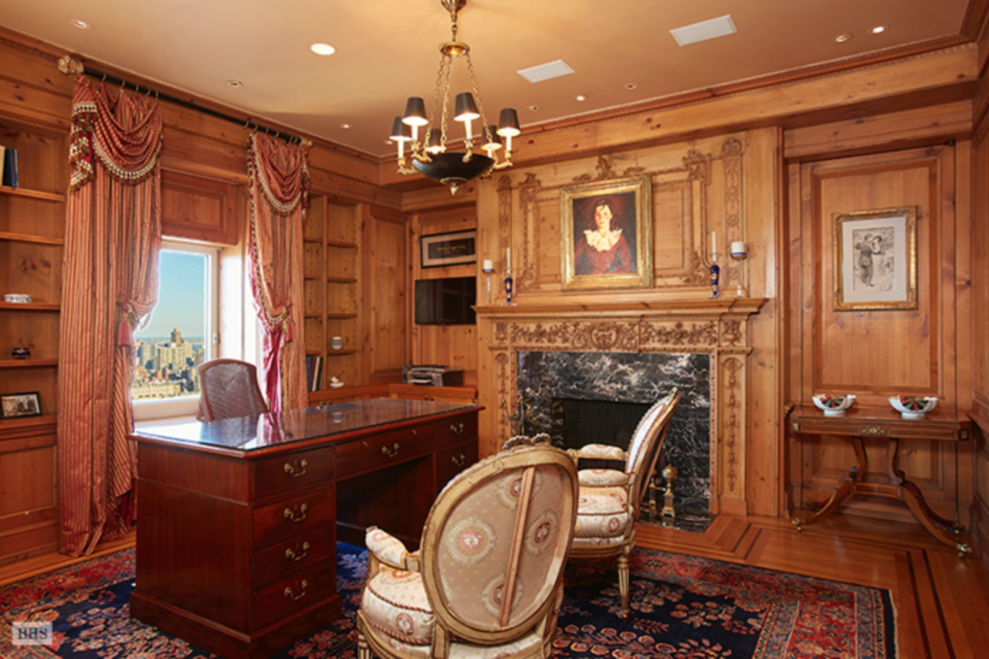 http://www.bhsusa.com/manhattan/upper-east-side/795-fifth-avenue/coop/12025971# The paneled library with fireplace.