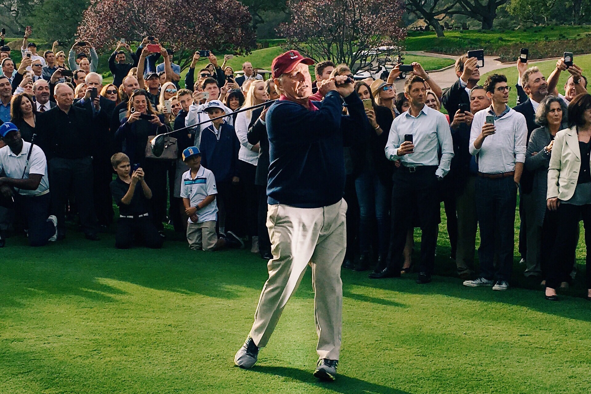 Jack Nicklaus tees off the weekend-long golf course opening with a flawless follow-through
