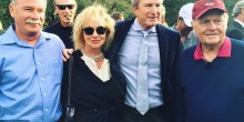 Nicole Van Parys and Gary Nesen pose with the man of the weekend Jack Nicklaus, with a perfect photobomb from Craig T. Nelson