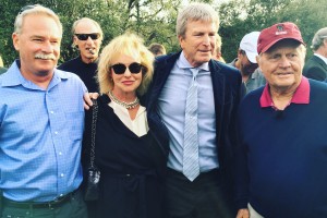 Nicole Van Parys and Gary Nesen pose with the man of the weekend Jack Nicklaus, with a perfect photobomb from Craig T. Nelson