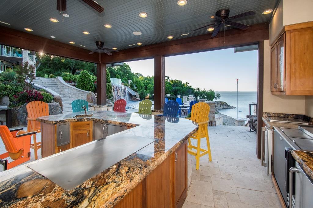 view from outdoor kitchen twilight - Haute Residence by Haute Living