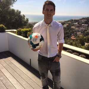 Messi on his Barcelona balcony