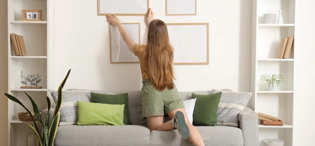 young girl decorating home walls