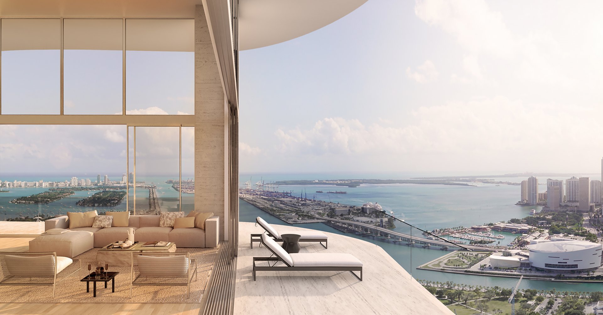 Casa Bella Residences living room opening to a terrace with views of Biscayne Bay and Kaseya Center