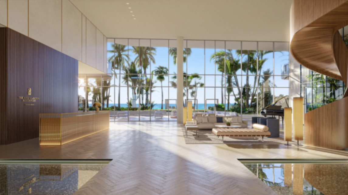 Ritz-Carlton Residences Pompano Beach lobby with ocean views through floor-to-ceiling glass